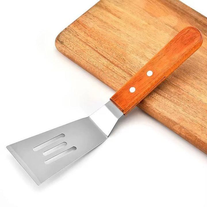 Spatule Perforée en Acier Inoxydable avec Manche en Bois – L’Outil Parfait pour Vos Cuissons